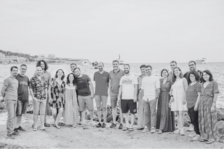 The MindWave team gathered together by the sea